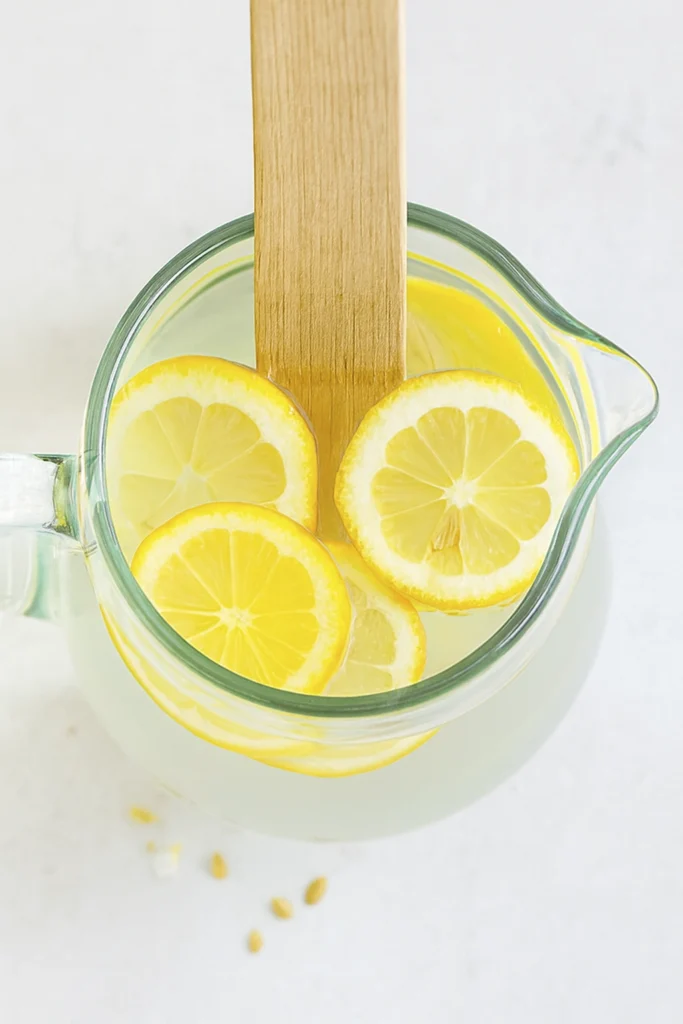 Cucumber lemon water in a glass pitcher – lemon water recipe for detox