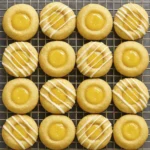 Lemon Thumbprint Cookies filled with lemon curd and drizzled with icing