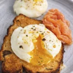 Gourmet poached egg on toast with smoked salmon