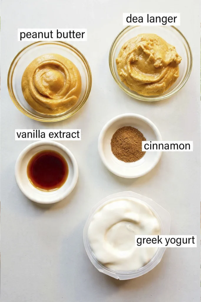 Greek Yogurt Apple Dip ingredients including peanut butter, agave syrup, vanilla extract, cinnamon, and Greek yogurt